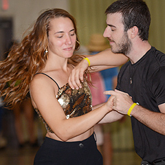 A couple dances by the Main Stage tent