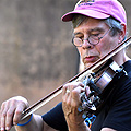 A man plays a fiddle