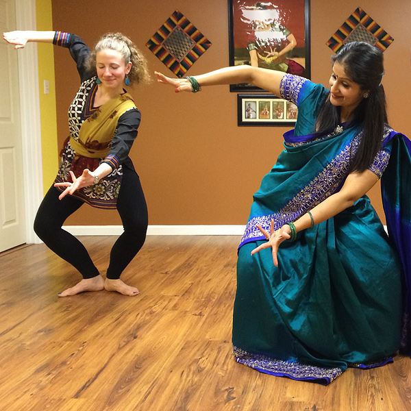 Rachita Nambiar demonstrates traditional Indian dance with an adult student