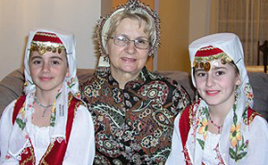 Master artist Mensura Berberovic with two apprentices, young girls who are learning Bosnian ballads.
