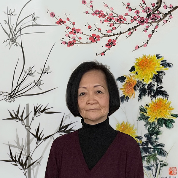 Diana Meng is a slender woman who appears to be in her seventies. She has chin-length black hair, slender eyebrows, and wears a black turtleneck and dark maroon cardigan.