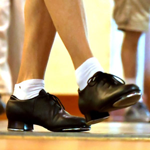 person wearing tap-dance shoes, from mid-calf down